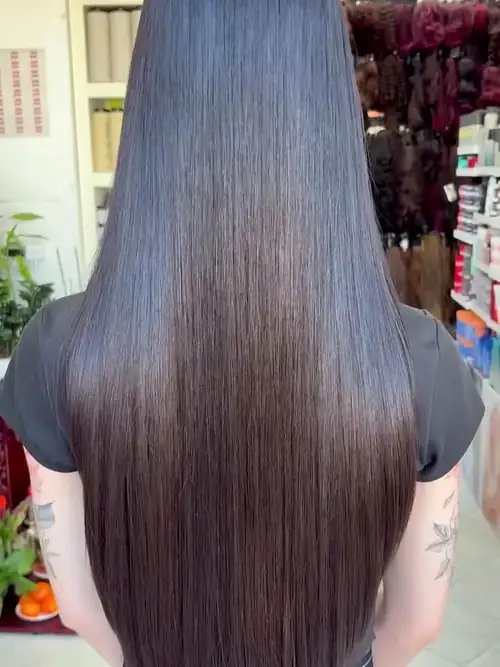 Very long, straight dark hair with a U-shaped layered cut